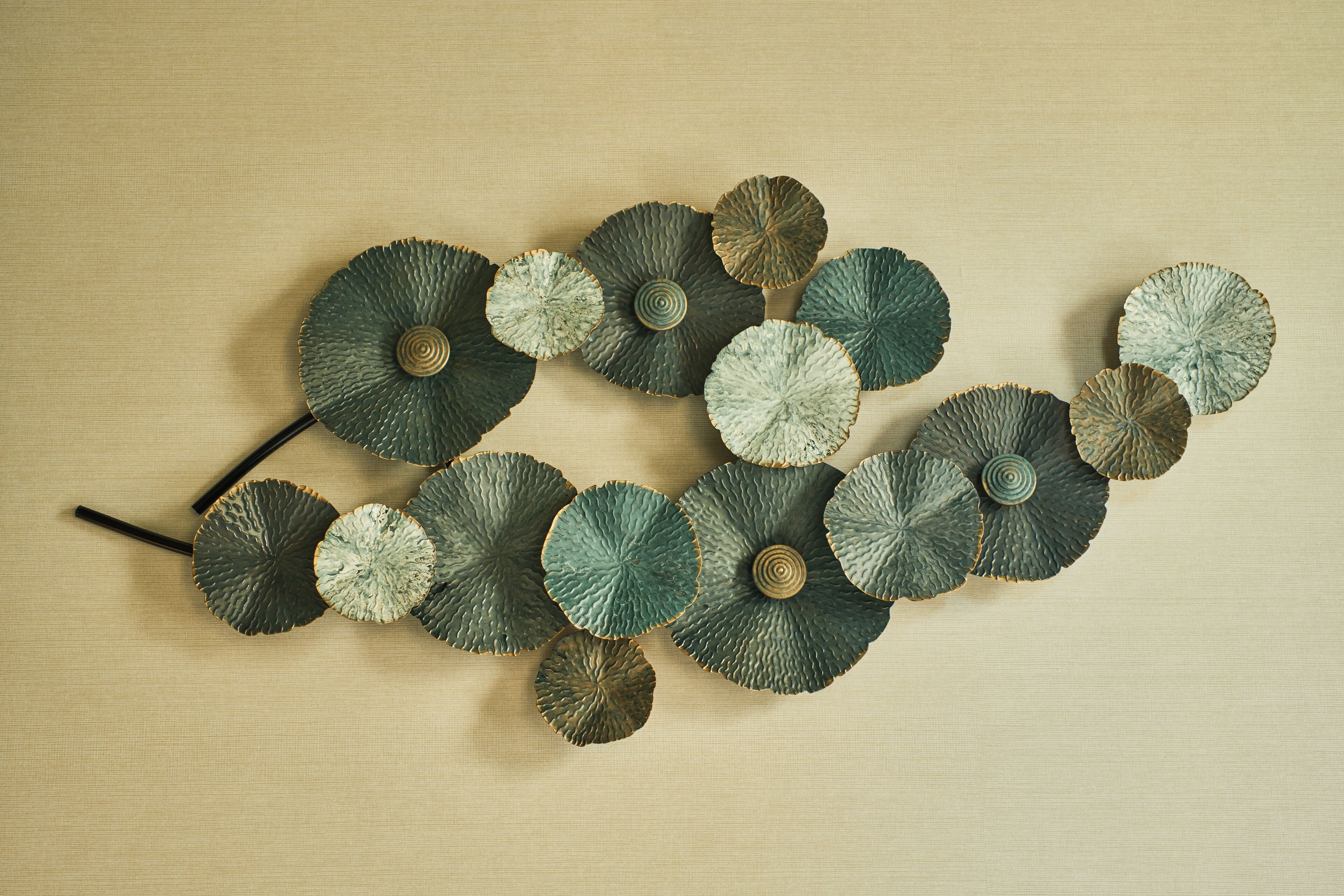 A collection of textured, circular objects arranged on a beige surface.