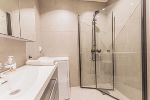Shower, hair dryer, towels, soap