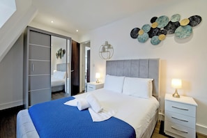 Appartement, 1 slaapkamer | Een strijkplank/strijkijzer, gratis wifi, beddengoed