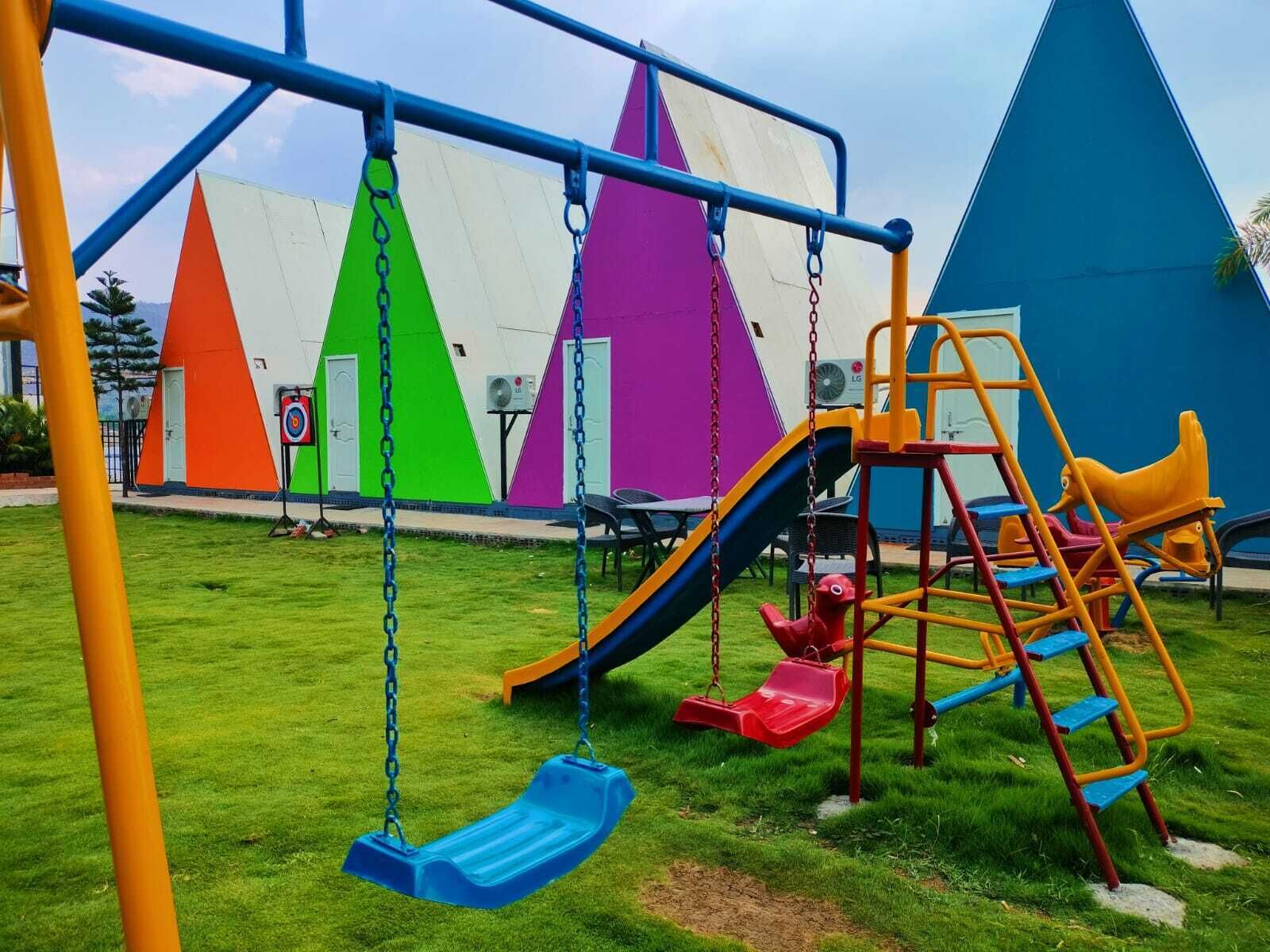 A playground with swings, slides, and climbing structures.