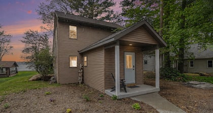 NEW LISTING: Beautiful cottage on the shores of Silver Lake with stunning water & dune views.