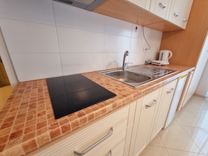 Fridge, electric kettle, toaster, cookware/dishes/utensils