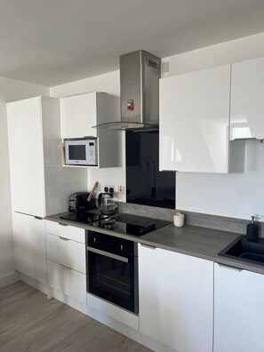 Apartment | Private kitchen | Fridge, microwave, oven, stovetop - Portrush 2-bed Apt, Sleeps 4, Parking (Portrush)