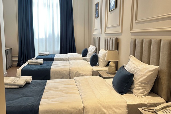Comfort Triple Room, City View | In-room safe, desk, laptop workspace, blackout drapes