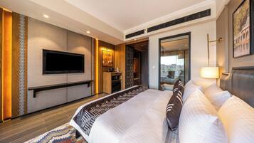 Premium Room with Lounge Area | Desk, iron/ironing board, bed sheets