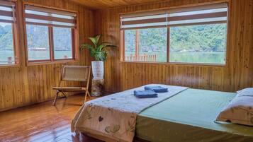 Habitación doble, patio, vista a la playa | Área de sala de estar