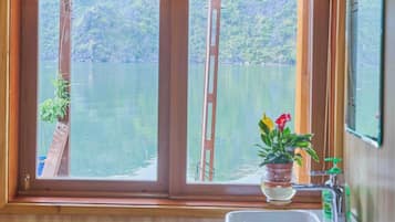 Double Room, Patio, Beach View | Bathroom | Shower, hair dryer, slippers, towels