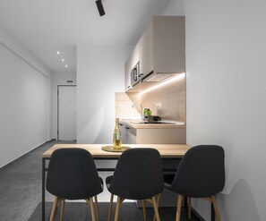 Studio, Balcony | In-room dining