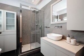 Shower, hair dryer, towels, soap