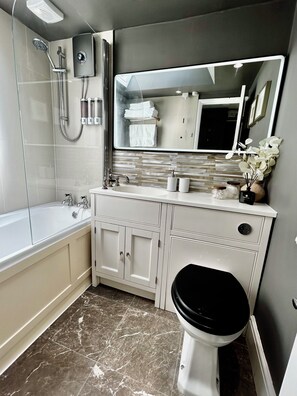 Hair dryer, towels, soap, shampoo