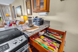 A kitchen with a stove, toaster, and a drawer with colorful utensils. - FALL SPECIAL!!! Spacious & Remodeled Maui Vista 3213 Corner Unit! (Kihei)