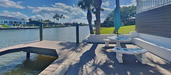 Dolphin View Oasis | Spacious Pet-Friendly Canal-front Home with Game Room+ Dock