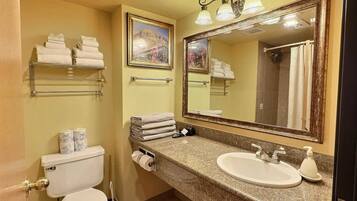 Shower, hair dryer, towels, shampoo