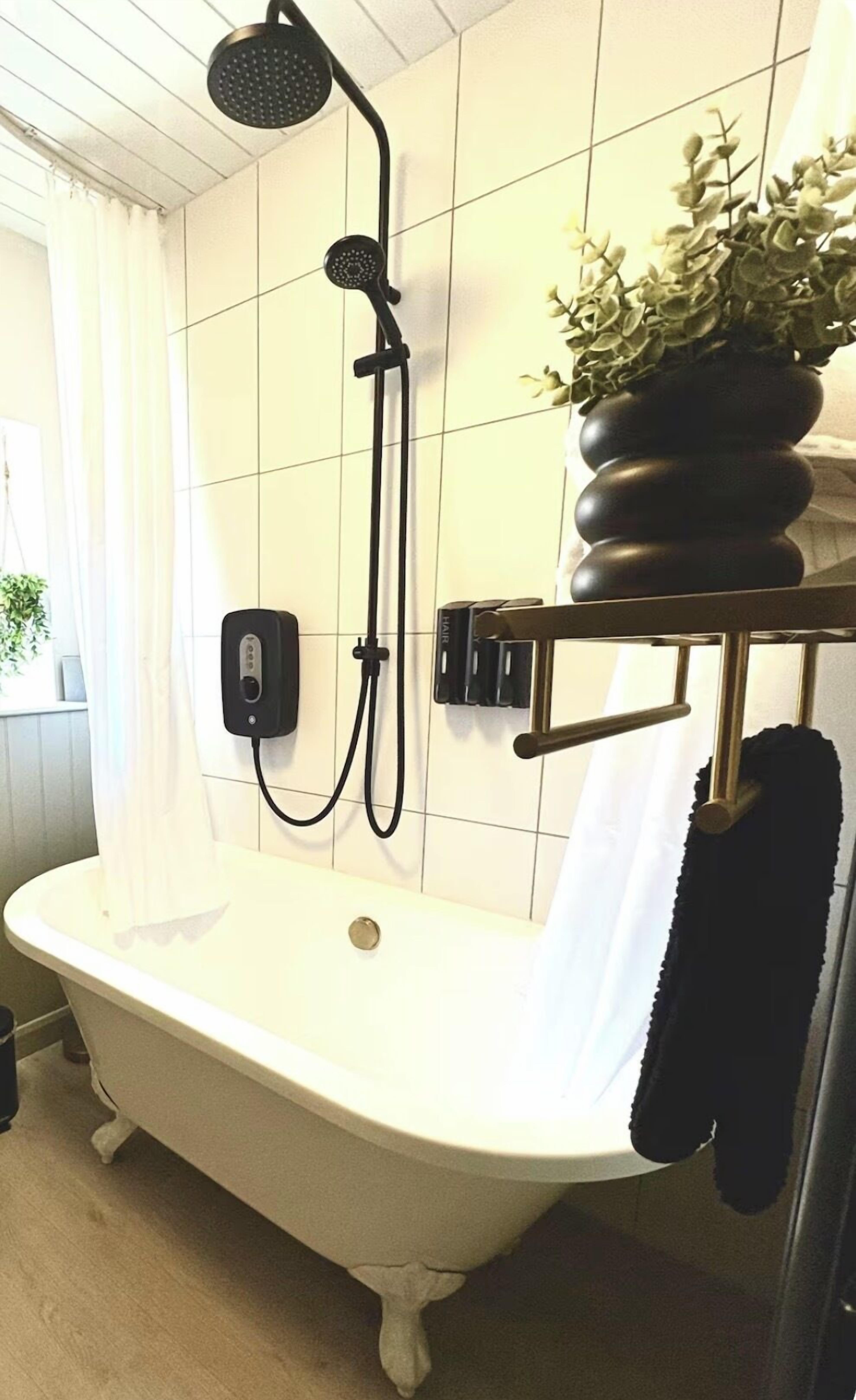 Shower, eco-friendly toiletries, hair dryer, towels