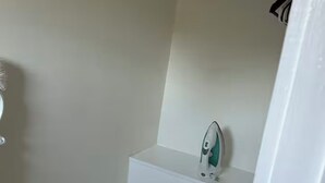 A small, white staircase leading to a bathroom with a single showerhead. -  Cozy Cape Cod in lovely Allentown with modern amenities (Allentown)