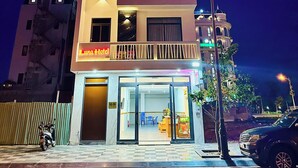 A multi-story hotel with balconies and a visible entrance. - Luna Hotel Phan Thiet (Phu Thuy)