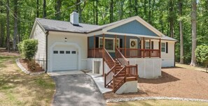 Stroll up to the front entrance of this charming home, where a covered porch awaits.