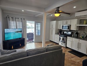 Deluxe Apartment, 216A Lower Level | Living area | Smart TV