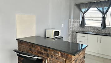Suite de lujo, vista a la montaña | Cocina privada | Frigobar