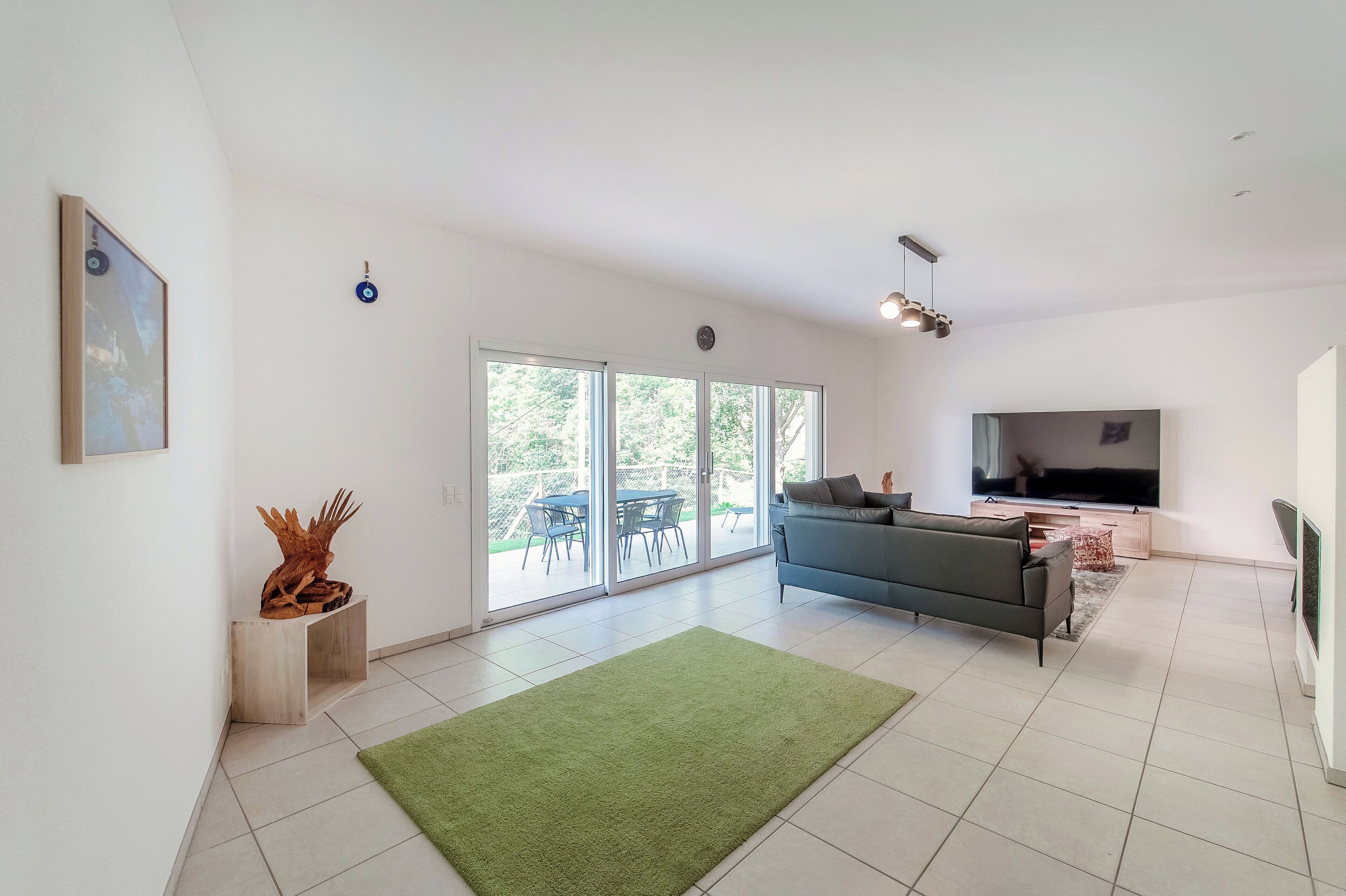 Comfort Apartment, River View | Living area | 65-inch flat-screen TV with digital channels