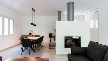 Comfort Apartment, River View | Living area | 65-inch flat-screen TV with digital channels