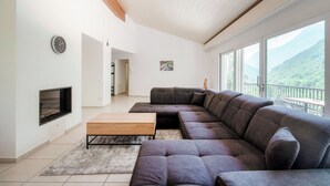 Deluxe Apartment, Patio, River View | Living area | 65-inch flat-screen TV with digital channels - Casa Bianca  (Sonogno)