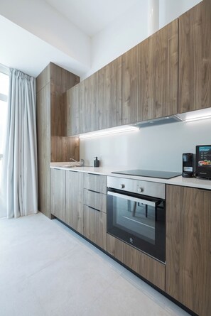 Superior Studio | Private kitchen | Fridge, microwave, oven, stovetop