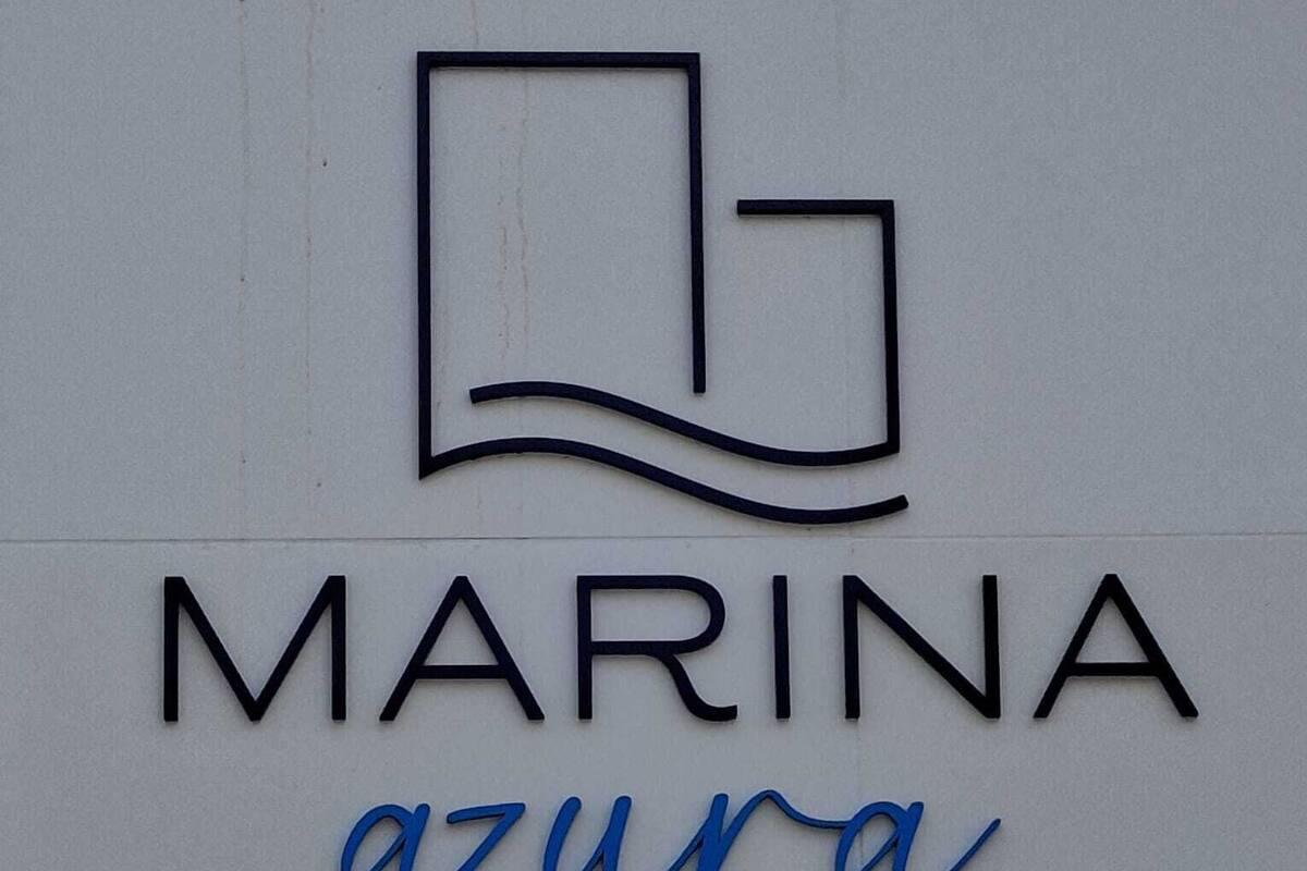 A logo with the word "MARINA" and the word "azura" below it.