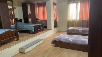 Deluxe Triple Room | 1 bedroom, minibar, desk, laptop workspace
