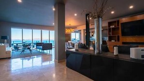 Căn hộ Deluxe, quang cảnh bãi biển | Khu phòng khách