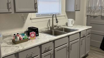 Fridge, microwave, stovetop, coffee/tea maker