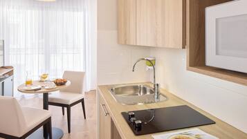 Mini-fridge, microwave, stovetop, coffee/tea maker