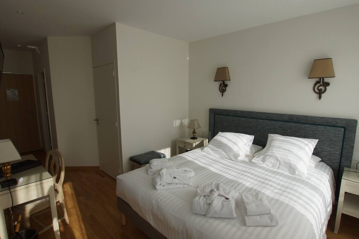 Superior Quadruple Room | Minibar, in-room safe, laptop workspace, blackout drapes