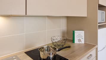 Apartment, 2 Bedrooms | Private kitchen | Mini-fridge, microwave, stovetop, cookware/dishes/utensils