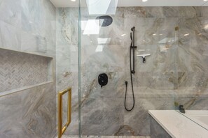 Shower, hair dryer, towels, soap