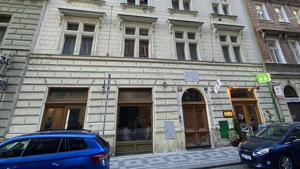 A historic building with a classic architectural style, featuring multiple windows and a prominent entrance. - Cozy Luxe Home at the Heart of Old Prague Centre (Hlavní mesto Praha)