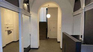 A hallway with arched ceilings and a staircase leading to another level. - Cozy Luxe Home at the Heart of Old Prague Centre (Hlavní mesto Praha)