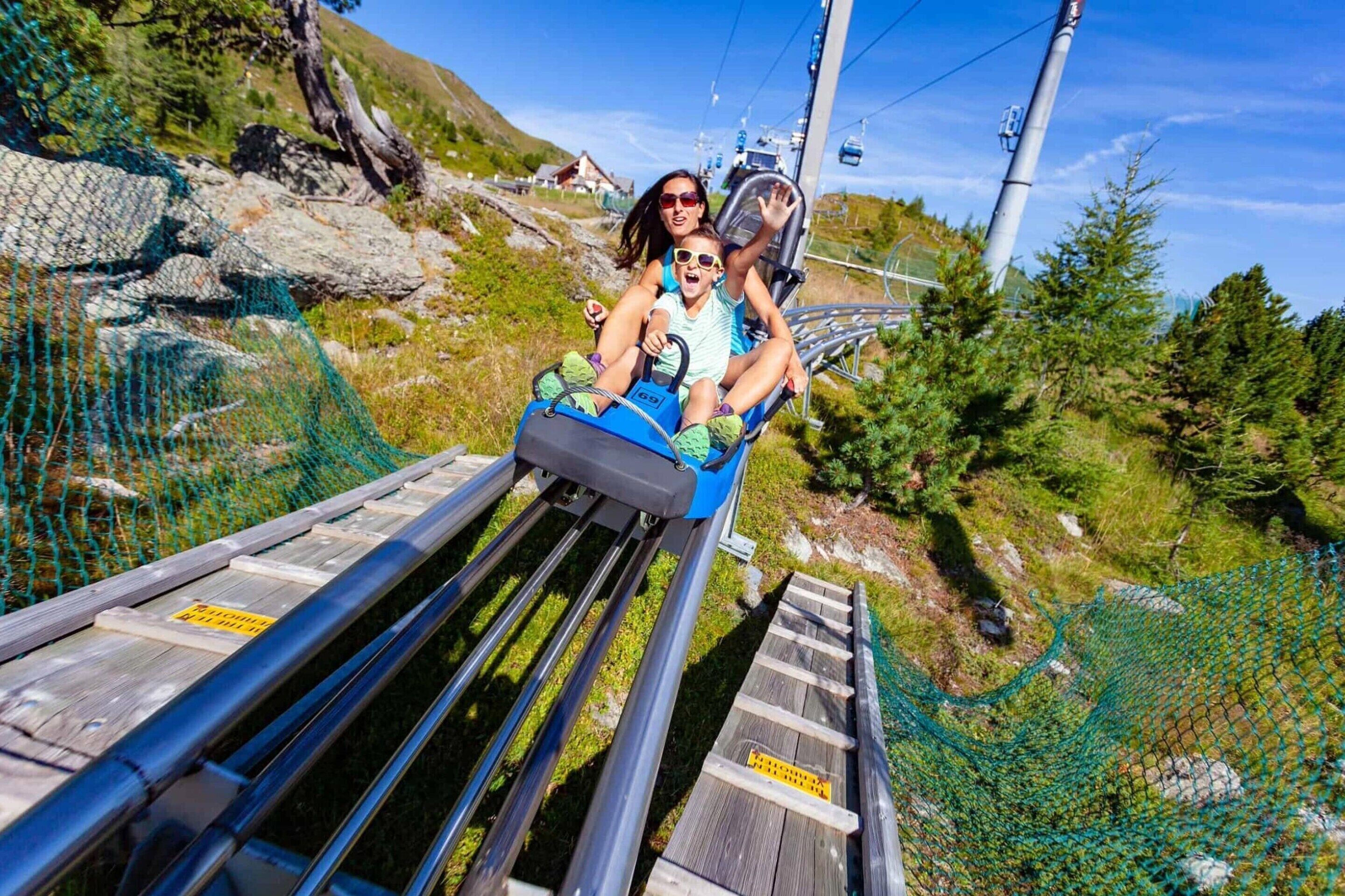 A wooden roller coaster track with a safety net on one side.