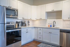 Fridge, coffee/tea maker, cookware/dishes/utensils