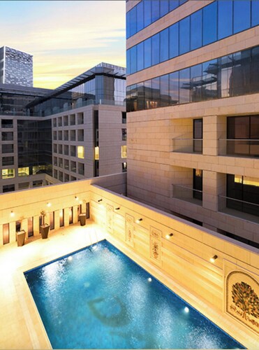 Live in the heart of Amman with this luxury one-bedroom suite featuring two balc