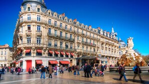 A historic building with ornate architecture, multiple balconies, and a central dome. - Charming Studio in Montpellier Méditerranée (Montpellier)