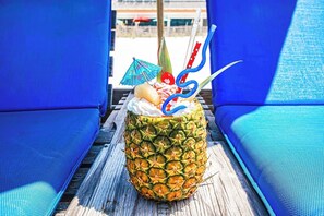 Enjoy a refreshing cocktail on the deck, surrounded by comfortable lounge chairs.