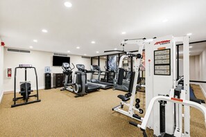 A well-equipped gym with treadmills, weight machines, and a variety of fitness equipment.