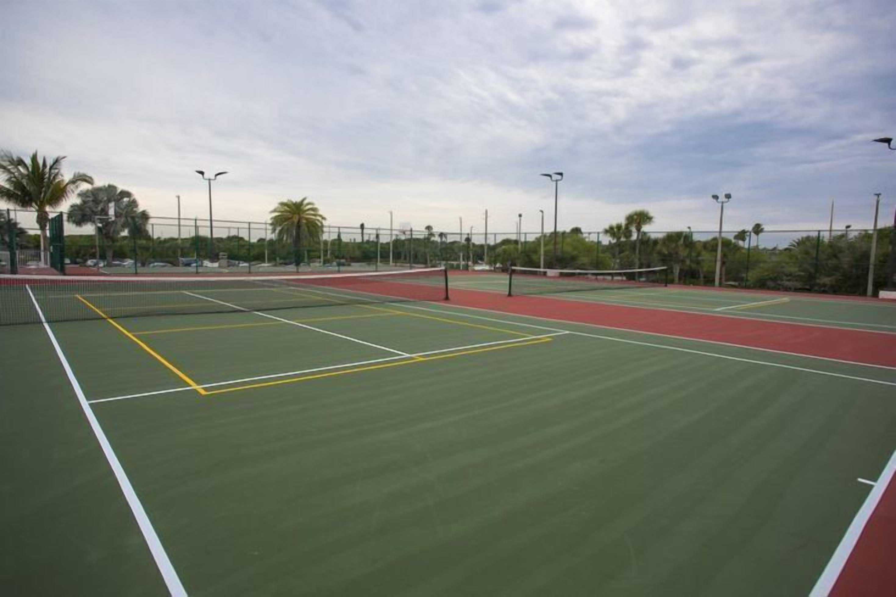 The well-maintained tennis courts provide ample space for family fun and friendly competition in a beautiful setting.