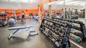 A gym with various exercise equipment, including treadmills, stationary bikes, and weight machines. - 1-Bedroom Condo near Lake Wallenpaupack (Hawley)