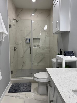 Shower, hair dryer, towels, soap