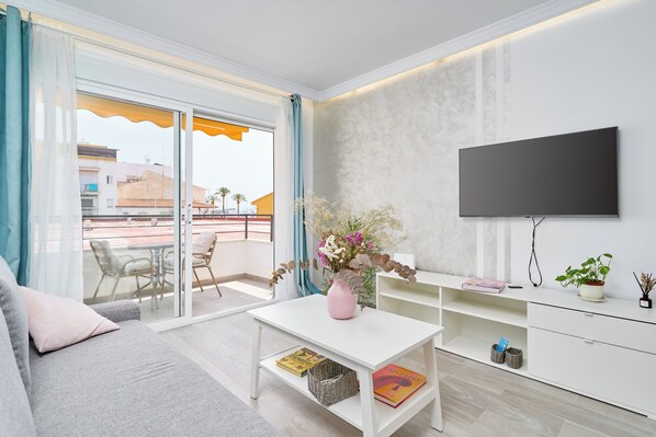 TV - Beachside Bliss Apartment with Shared Pool, Wi-Fi, and Air Conditioning (Caleta de Velez)