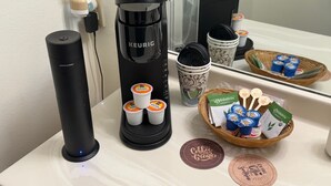 A coffee station with a Keurig coffee maker, disposable cups, and coffee pods. - 113 -The Sandlot- King Suite & Silver Dollar City Gem! (Branson)