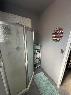 Shower, hair dryer, towels, soap