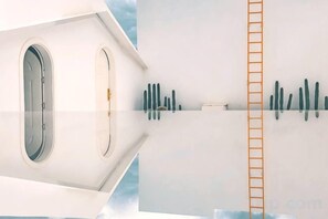 A room with a large window, a ladder, and a wall-mounted object. - Langyue Hanfu Travel Theme Inn (Lijiang Ancient City Branch) (Lijiang)